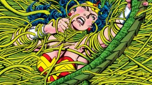 Wonder Woman claws against vines strangling her.