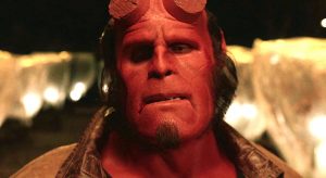 Hellboy grimaces as he thinks of his next move