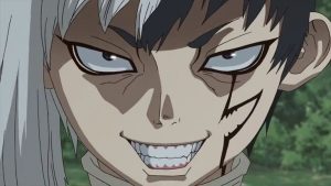 Face close up of Gen in Dr. Stone, who is looking sinister with an evil grin.