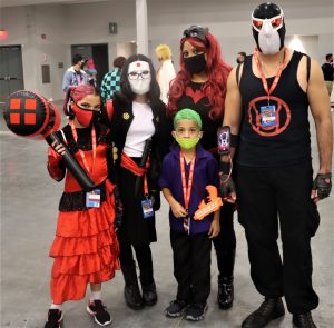 A family cosplays various DC characters at Florida Supercon 2021