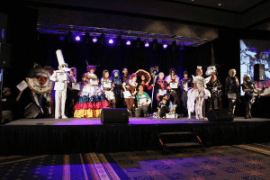 group of cosplayers on stage for awards