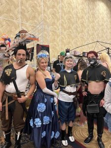 black clover cosplays featuring captian yami, captain charlotte, Asta with the bird nero on his head, and zora