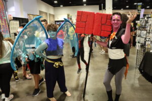 cosplayers pose for a phot at Tampa Bay Comic Convention 2021